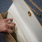 possala designs handmade in asturias beige calfskin structured flap baguette bag with gold plated hardware