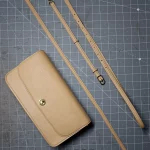 possala designs handmade in asturias beige calfskin structured flap baguette bag with gold plated hardware